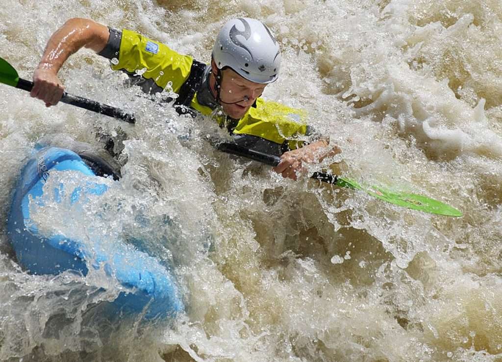 Whitewater kayaking on Shepperton Weir, UK